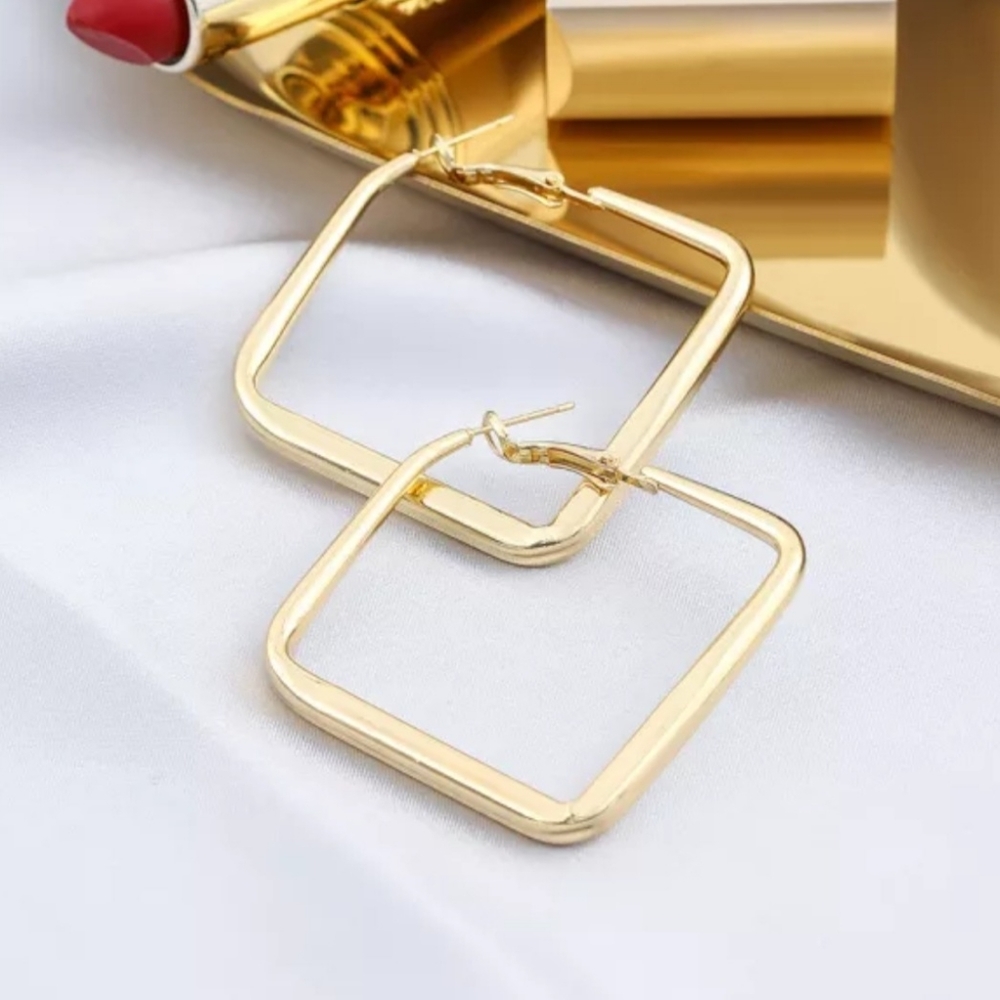 Gold toned pierced earrings